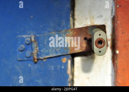 Padlock keyhole on blue wooden door background Stock Photo