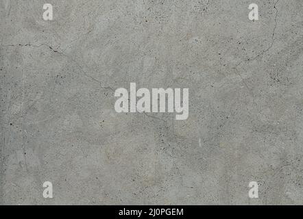 Grey concrete background. Cement wall with cracks. Stock Photo