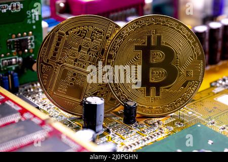 Bitcoin coins and printed circuit board PCB Stock Photo