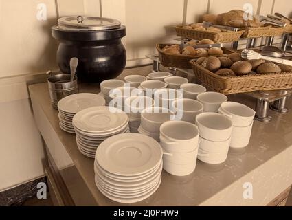 Empty clean dishes for tea or coffee on the table. Top view, pastel vintage tones. Stock Photo