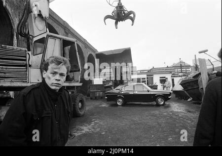 UB40 filming a video film in a scrapyard. The video film will feature songs from their album 'Labour of Love'. Pictured, Ali Campbell, lead singer with the band. 21st January 1983. Stock Photo