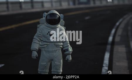 Astronaut walks in the middle of a road Stock Photo