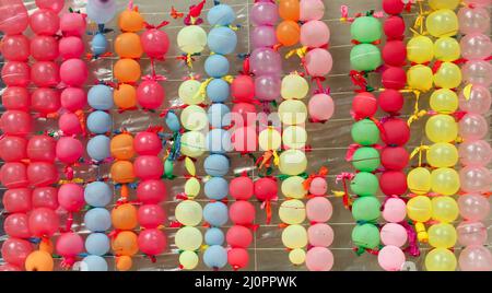 multi coloured balloon placed in the board for firing target in the park Stock Photo