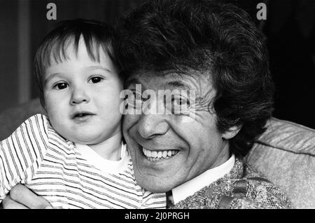 Lionel Blair pictured at home with his son. 19th October 1983. Stock Photo