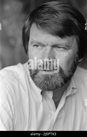 Glen Campbell in London. 19th April 1984 See another frame in this set that shows Glen, his wife Kim and son Cal.   Campbell  married to Kimberly 'Kim' Woollen in 1982.  The couple met on a blind date in 1981 when Woollen was a Radio City Music Hall 'Rockette'. Together, they have three children: Cal, Shannon, and Ashley.  All three have joined Campbell on stage since 2010 as part of his touring band.  Campbell's hits include his recordings of John Hartford's 'Gentle on My Mind'; Jimmy Webb's 'By the Time I Get to Phoenix', 'Wichita Lineman' and 'Galveston'; Larry Weiss's 'Rhinestone Cowboy';