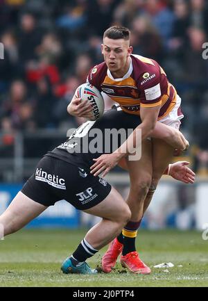 Huddersfield Giants' Owen Trout is tackled by Hull FC's Jack Brown during the Betfred Super League match at the MKM Stadium, Kingston upon Hull. Picture date: Sunday March 20, 2022. Stock Photo