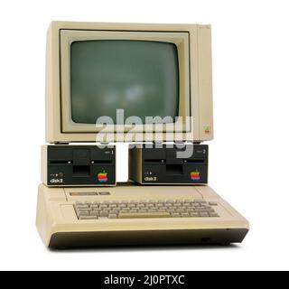 Munich, Germany, March 10, 2016: Apple II computer with foam-molded plastic case in BMW Welt museum. It was the first consumer p Stock Photo