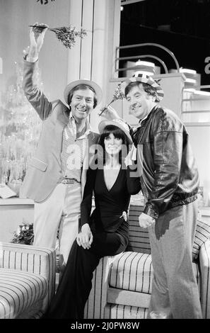 Des O'Connor plays genial host to his guests Jimmy Tarbuck and Mart Caine. The recording of Des' first ITV Christmas Show was taking place at Thames studios. 18th November 1983. Stock Photo