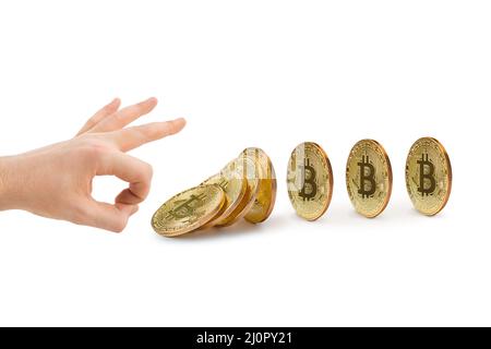 Hand and falling bitcoins Stock Photo