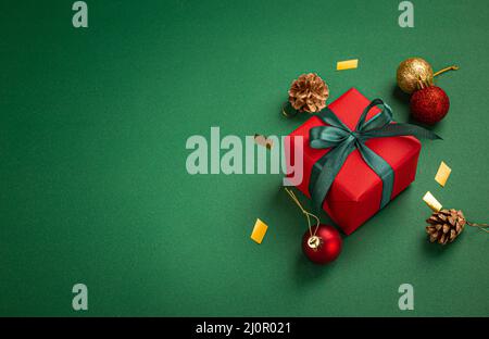 Christmas composition with present and decorations in red, green, golden colors Stock Photo