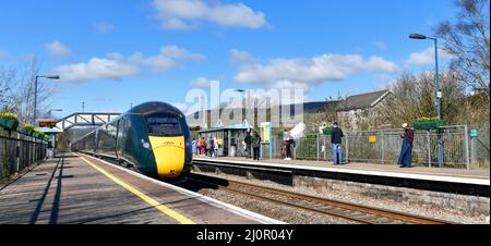 Pontyclun, Wales - March 2022:  High speed train operated by Great Western Railway passing through the railway station in the village of Pontyclun Stock Photo