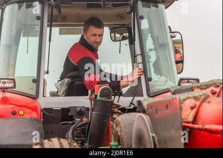 Kilmeen, West Cork, Ireland. 20th Mar, 2022. A ploughing match took place today on the lands of John and Declan Buttimer, Rossmore. A large number of competitors took part in what is the penultimate ploughing match of the season with the Kilbrittain match next weekend. Competing in the match was Liam O'Driscoll from Kilbrittain. Credit: AG News/Alamy Live News Stock Photo