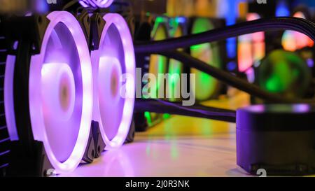 Many colorful coolers, cooling fans with neon LED light at computer exhibition Stock Photo