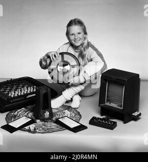 A young girl with a selection of children's toys. 11th November 1983. Stock Photo