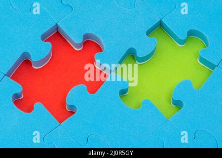 Missing red and green puzzle pieces Stock Photo