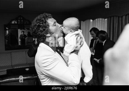 Tom Jones with his grandson Alexander, aged eleven months, in their London hotel. 3rd September 1983. Stock Photo
