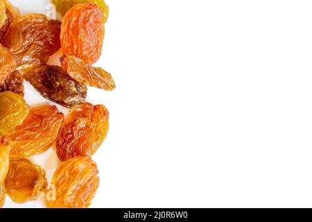 Top view yellow raisins isolated on white background. Stock Photo
