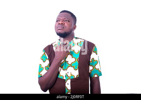 handsome serious young man holding his fingers around his neck. Stock Photo