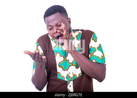 handsome young sick man suffering from tooth pain holding hand on cheek. Stock Photo