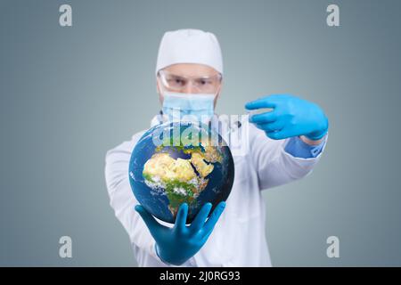 Doctor hold a earth globe in hands and a medical syringe with vaccine against corona virus. 3D rendering. Elements of this image Stock Photo
