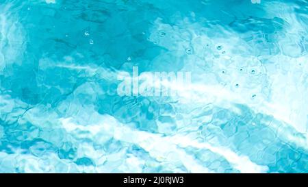 Water swimming pool texture and surface water on pool, reflection blue wave nature water on the outdoor swimming pool Stock Photo