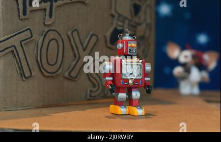 A toy robot  on display in a toy store window Stock Photo
