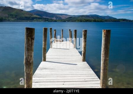 Long exposure of a jetty on Derwent water in the Lake District in Cumbria in the UK Stock Photo