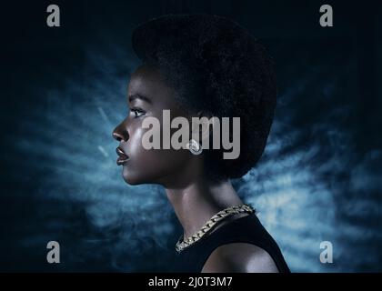 Young black woman profile beauty portrait on dark background Stock Photo