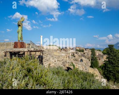 Statue of Deadalus with Pompeii site in background Stock Photo