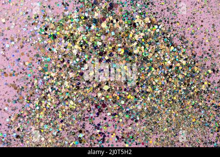 Gold sequins on pastel pink background. Festive concept. High quality photo. Stock Photo
