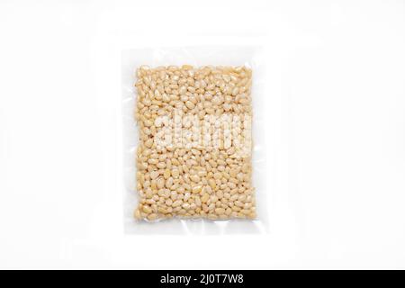 Peeled Pine Nut In Transparent Vacuum Plastic Packaging On White Background Stock Photo