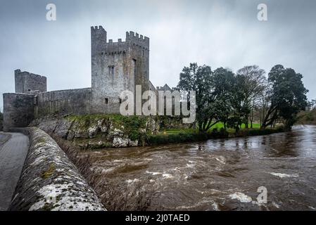 Dramatic view of ancient, medieval Cahir Castle from across the River Suir in Cahir, County Tipperary, Ireland. Stock Photo