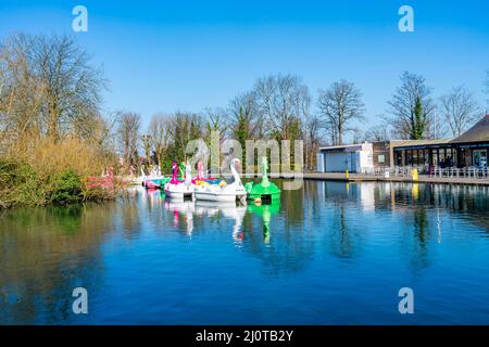 LONDON, UK - MARCH 19, 2022: View of boating lake with Lakeside Café and pedal boats on at Alexandra Palace in London Stock Photo