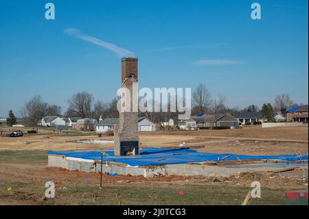 Dawson Springs, KY, January 22, 2022 -- This town was hit hard by the tornado that torn through in December. All that remains of this home is a chimney, with the wood intact. Photo by Liz Roll/FEMA Stock Photo