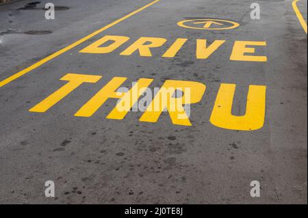 Drive thru sign on tarmac Stock Photo