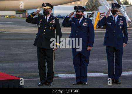 U.S. Army Maj. Gen. Jose Reyes, adjutant general, Puerto Rico National Guard; U.S. Air Force Travis Acheson, assistant adjutant general - Air, Puerto Rico National Guard, and Col. Pete Boone, 156th Wing commander, Puerto Rico Air National Guard, salute the colors during the playing of the national anthem during the arrival ceremony of King Felipe VI at Muñiz Air National Guard Base, Puerto Rico, Jan. 24, 2022. The king of Spain is visiting Puerto Rico to commemorate the fifth centennial founding of the capital city of San Juan, Puerto Rico. (U.S. Air National Guard photo by Master Sgt. Rafael Stock Photo