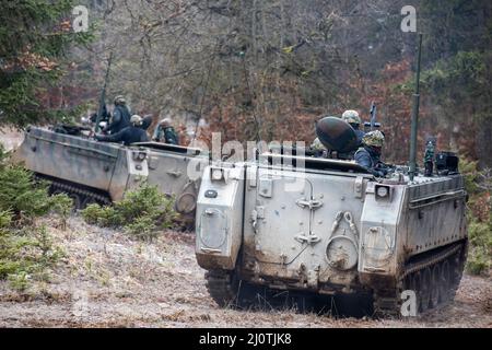 U.S. Army Soldiers assigned to 1st Battalion, 4th Infantry Regiment acting as opposing forces during Allied Spirit maneuver M113A3 armored personnel carriers in Hohenfels, Training Area, Germany Jan. 25, 2022. Allied Spirit is a United States Army Europe-Africa directed, 7th Army Training Command conducted, Joint Multinational Readiness Center hosted training exercise for the Latvian 1st Mechanized Infantry Brigade from Jan. 11, 2022 to Feb. 5, 2022. The exercise will develop and enhance NATO and key partner interoperability and readiness across specified warfighting functions. (U.S. Army ph Stock Photo