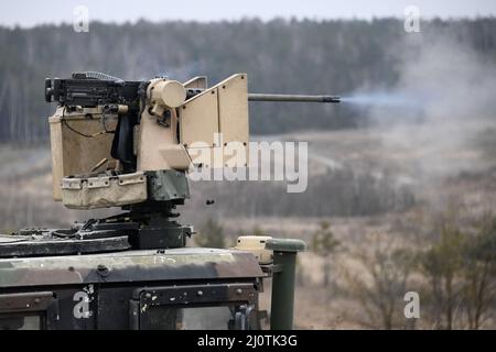U.S. Army paratroopers with 2nd Battalion, 503rd Infantry Regiment, 173rd Airborne Brigade fire a .50 caliber machine gun from a M1151 HMMWV during exercise Rock Harvest at the 7th Army Training Command's Grafenwoehr Training Area, Germany, Jan. 25, 2022. The 173rd AB is the U.S. Army Contingency Response Force in Europe, capable of projecting ready forces anywhere in the U.S. European, Africa or Central Commands' areas of responsibility. (U.S. Army photo by Gertrud Zach) Stock Photo