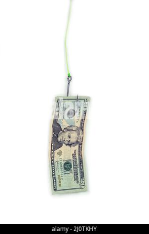 Twenty dollar bill dangling from a fish hook on white background Stock Photo