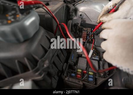 Male holding device and checking details of machine Stock Photo