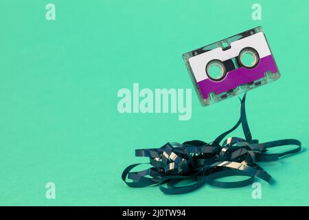 Purple cassette with pulled out tape Stock Photo