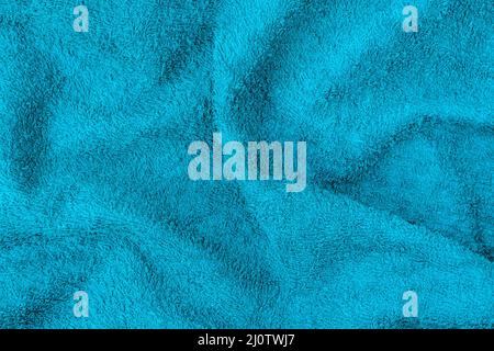 Undulating blue plush bath towel fabric Stock Photo
