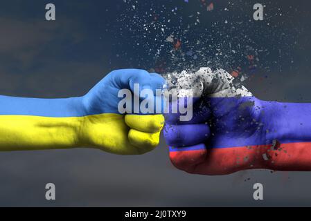 War between Ukraine and Russia. Ukraine's victory in the war. The concept of a military operation in ukraine, two fists painted in the colors of the Stock Photo