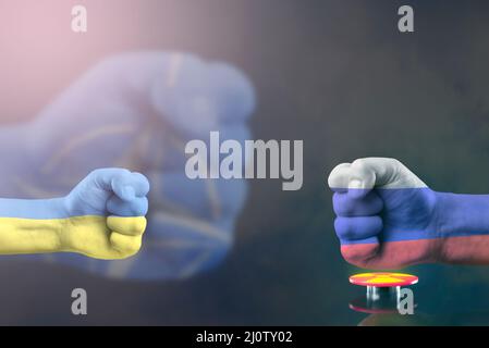 Confrontation NATO and Russia. Military conflict in Ukraine. The threat of nuclear war. NATO fist breaks a fist painted in the colors of the Russian Stock Photo