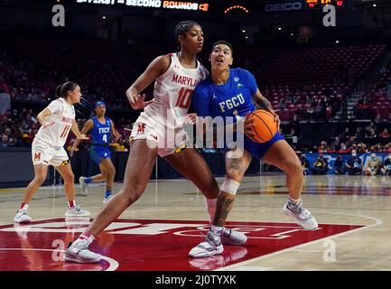 COLLEGE PARK, Maryland, USA - 20 MARCH 2022: Maryland Terrapins forward Angel Reese (10) defends against Florida Gulf Coast Eagles guard Kierstan Bell (1) during a NCAA women's basketball tournament second round game between the Maryland Terrapins and the Florida Gulf Coast Eagles, on March 20, 2022, at Xfinity Center, in College Park, Maryland. (Photo by Tony Quinn-Alamy Live News) Stock Photo