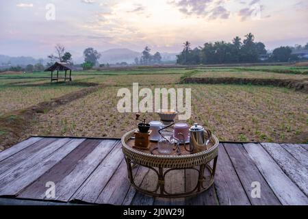 Nan Thailand, drip coffee with a look over the rice fields paddies in the morning during sunrise, coffee in the morning Stock Photo