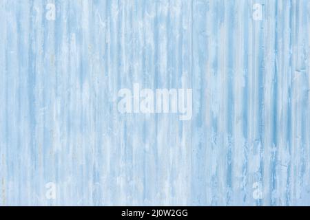 White and blue corrugated metal fence background. Stock Photo