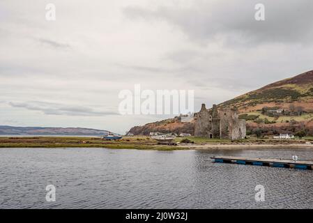 Lochranza Castle on the north coast of Arran Scotland. Lochranza Castle is an L-plan fortified tower house situated on a promontory in Lochranza. Stock Photo