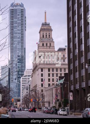 TORONTO, CANADA - 01 04 2020: Autumn view along University ave with Canada life building. The Canada Life Building is a 87 m high fifteen-floor Stock Photo