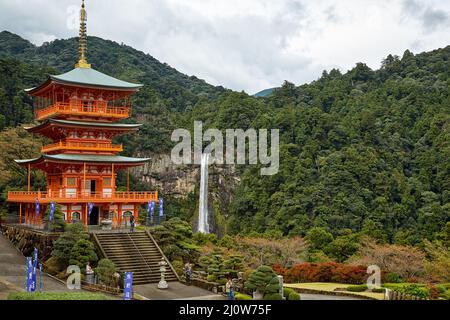 Three Story Pagoda of Seigantoji Temple with the Nachi fall  on the background. Wakayama. Japan. Stock Photo